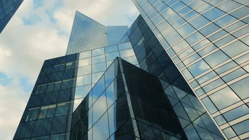 Modern Glass Skyscrapers Reflect Sky in City Environment