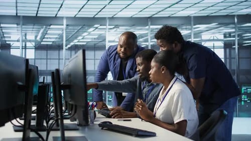 Teamworking Engineers Talking in Server Room Doing Brainstorming