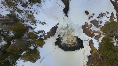 Fly over a waterfall in Gooseberry Falls State Park without people.