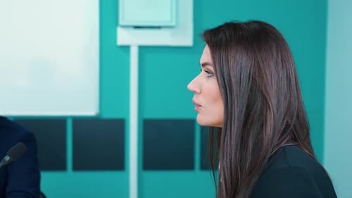 Young Businesswoman Speak at a Meeting in the Office Room Woman Lecturer Communicates with