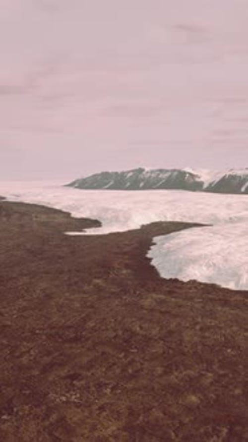 A Majestic Glacier Surrounded By Towering Mountains