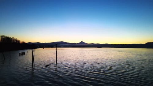 Water Scene With Silhouetted Mountains at Sunset