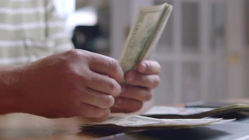 Counting Stack of US Hundred Dollar Bills