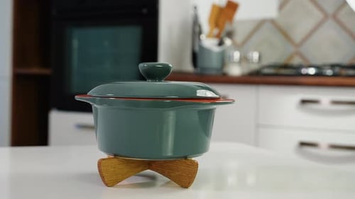 Ceramic Pan on Handmade Wooden Stand Rotate in a Kitchen