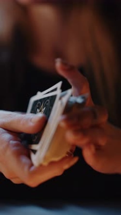 Woman Shuffles Tarot Cards for a Reading
