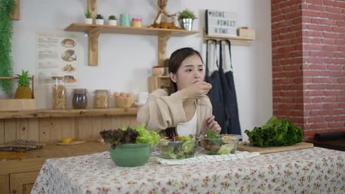 Woman Enjoys a Healthy Salad in Her Kitchen