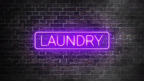 Tabuleta de néon de lavanderia cintilando no fundo da parede de tijolos. Letreiro de lavanderia roxo luminoso
.