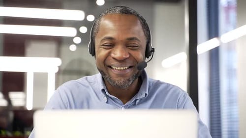 Man on video call in bright office