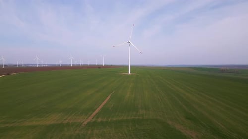 Aerial View of Wind Farm in Green Fields Renewable Energy Landscape