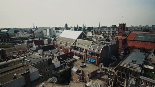 Zoom in shot of Amsterdam historical buildings and rooftops, Netherlands view from The Oude Church