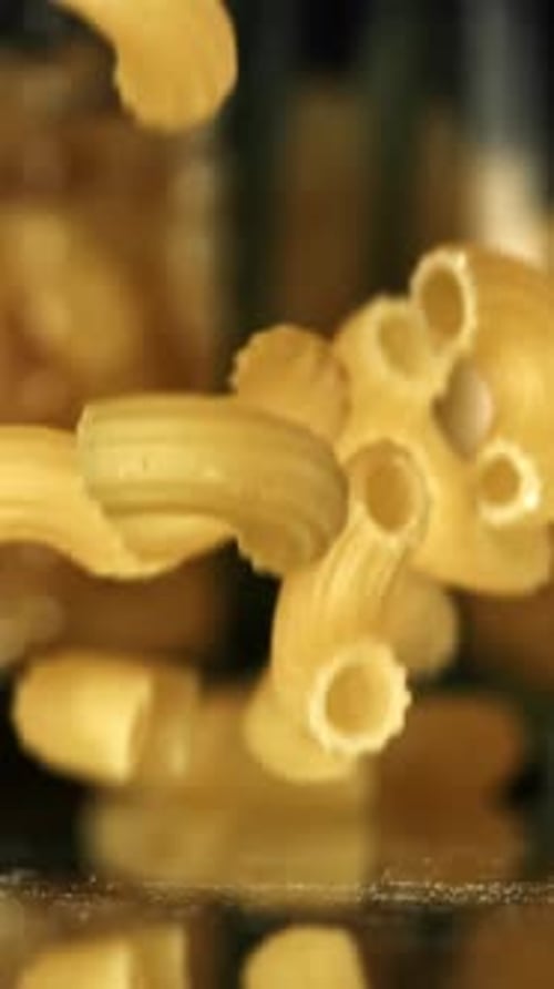 Super Slow Motion Dry Macaroni Pasta Filmed on a Highspeed Camera at 1000 Fps