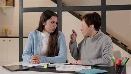 Teen Girl and Woman Arguing and Embracing Indoors
