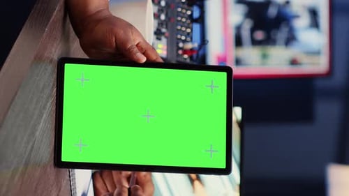 Vertical Video Green Screen Tablet Hold By Woman on Podcast Discussing with Guest During Marathon