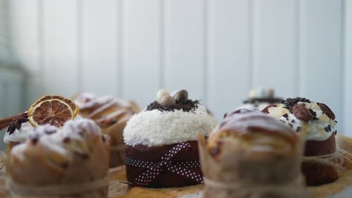 Traditional Easter Cakes Creatively Decorated with White Icing Candied Fruits Nuts and Chocolate on