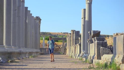 A Young Man Visits the Remarkable Ruins of the Ancient City of Perge in Conteprorary City of Antalya