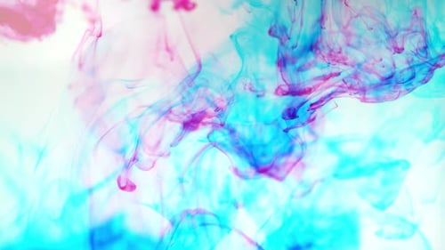 Abstract Pink and Teal Ink Swirling in Water