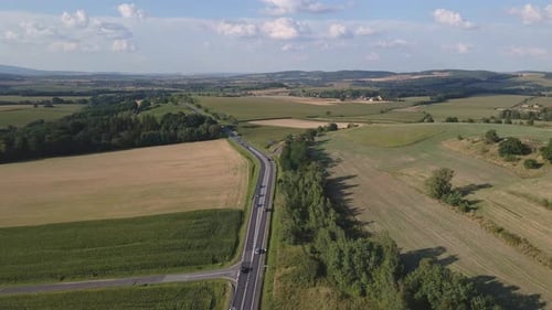 Countryside Suburban Area with Cars Driving on Highway Road Aerial View