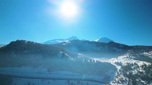 Snowy Mountains and Road Aerial in Winter