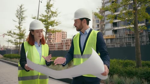 Two Contractors Civil Engineers Discuss Electrical Maintenance Blueprint Paper Partnership Discuss
