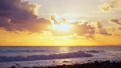Sun behind the clouds at the beach