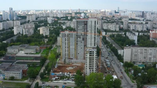 Top View of City with Construction of Highrise Building Stock Footage Construction of Multistorey