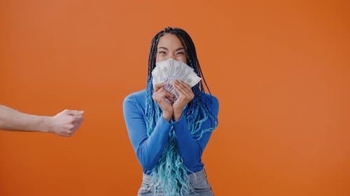 Young African American Woman Rejoices Receiving Money