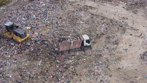 Aerial view of excavator working with trash on rubbish dump in Burgas, Bulgaria
