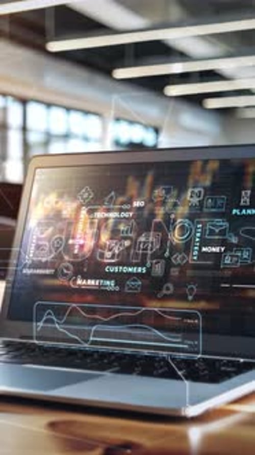 Laptop Showing Business Plan with Abstract Icons in Modern Office Setting