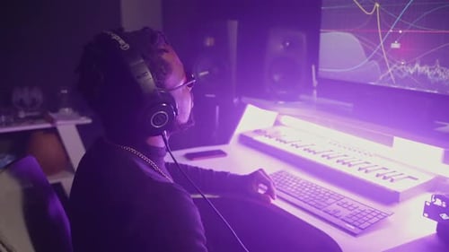 African American Man is Processing Music Records on High Tech Modern Equipment in Record Studio