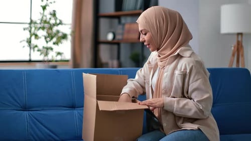 Muslim Woman Unpacking Cardboard Box Online Shopping Marketplace Order Desired Purchase Received