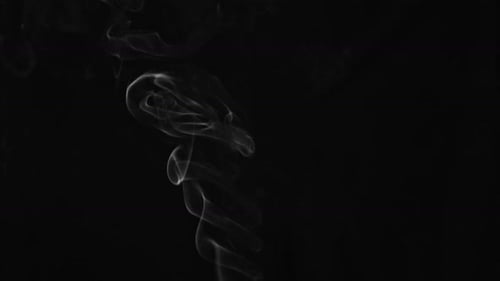 Wispy Smoke Rising on a Black Background