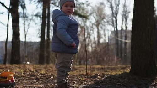 Happy Baby Child Outdoor Little Toddler Boy with Toy Car Having Fun on Walk in Park Baby Son Smiling