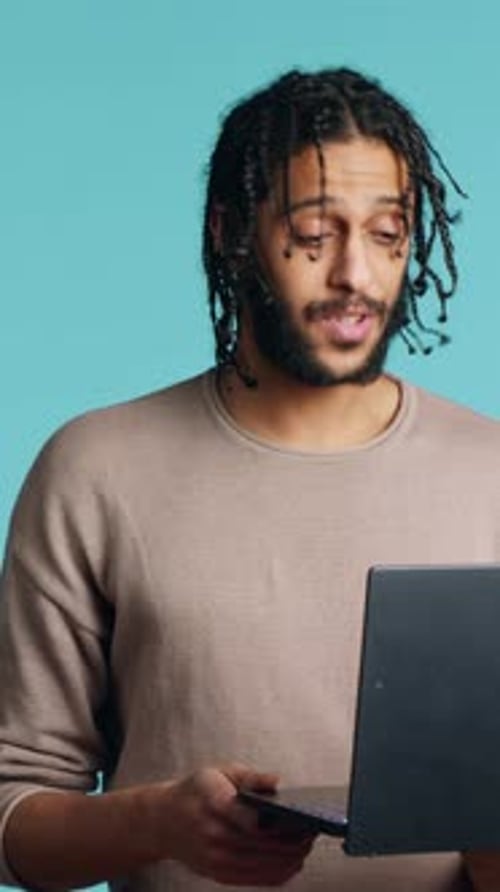 Vertical Video Happy Person Bonding with Mate Using Notebook to Hold Videoconference Studio