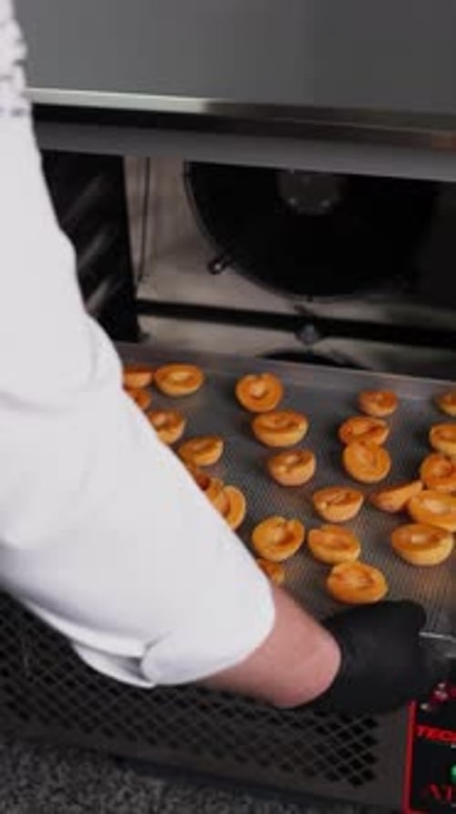 The chef cooks with apricots. Close-up