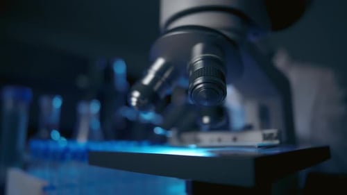Microscope in Dark Lab with Blue Light