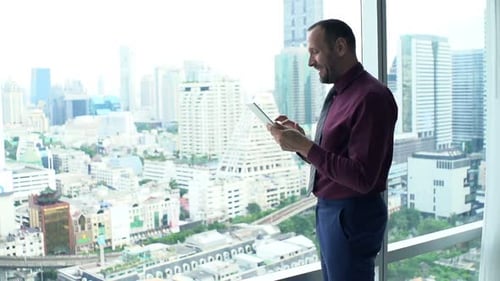 Happy Businessman Reading Good News on Tablet in Office, Super