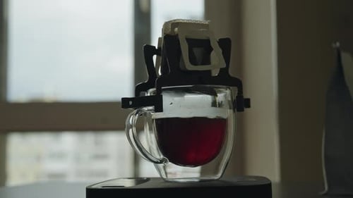 Fresh Coffee Drip in Clear Glass Mug