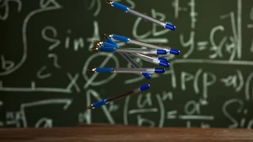 Pens Fall on the School Desk Filmed on a Highspeed Camera at 1000 Fps