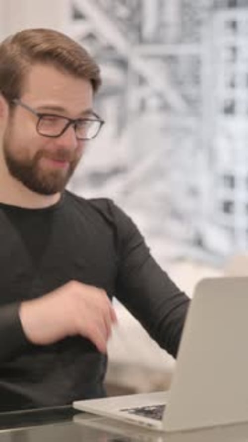 Man Chatting on Laptop during Video Conference