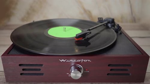 Vinyl Record Spinning with green screen croma on vinyl cover.