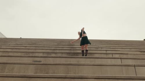 Woman Dancing Gracefully on Steps