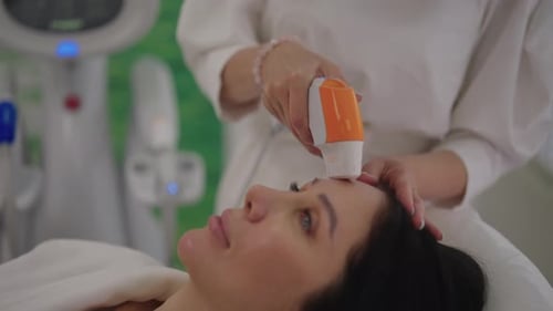 Woman Receives Facial Treatment in a Beauty Clinic