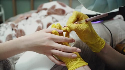 Nail Extension Service Manicurist Makes a Manicure Gel Nail Extension with Professional Tools for