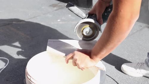 worker cutting tiles to tile terrace
