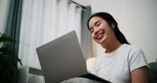 Young Woman Chatting on Laptop Video Call