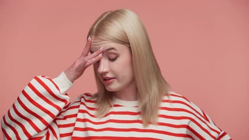 Young Woman With Headache in Studio Close Up