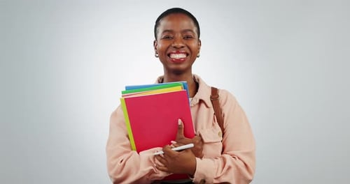 Woman, books and portrait of a student in studio excited about school, learning and education