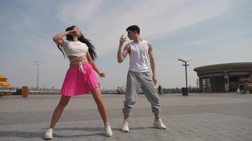 Street Dance in the City Square on a Summer Day Beautiful Dancing Couple Dancing Outdoors