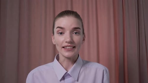 Young Woman Talking With Tablet Device