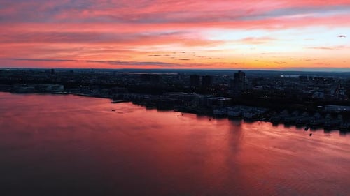 Silhouette of metropolis skyline at beautiful sunset. Amazing pink sky over New York city